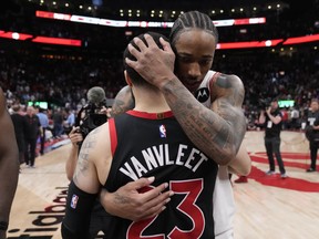 Chicago Bulls forward DeMar DeRozan (11) consoles former teammate Toronto Raptors guard Fred VanVleet (23) after NBA basketball action in Toronto on Wednesday, April 12, 2023. The Toronto Raptors are out of the NBA's play-in tournament after dropping a 109-105 decision to the Chicago Bulls.