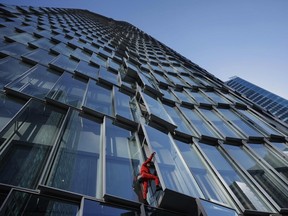 French high level climber Alain Robert popularly known as the "French Spiderman" climbs the Alto Tower, in La Defense near Paris, on April 19, 2023.