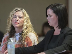 FILE - Lori Vallow Daybell glances at the camera during her hearing in Rexburg, Idaho., on March 6, 2020. The investigation started roughly 29 months ago with two missing children. It soon grew to encompass five states, four suspected murders and claims of an unusual, doomsday-focused religious beliefs involving "dark spirits" and "zombies." On Monday, April 10, 2023, an Idaho jury will begin the difficult task of deciding the veracity of those claims and others in the triple murder trial of Lori Vallow Daybell.