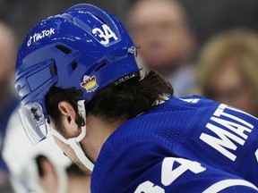 Toronto Maple Leafs' Auston Matthews (34) wears a pride-themed sticker on his helmet during first period NHL hockey action against the Columbus Blue Jackets in Toronto on Tuesday, April 4, 2023.