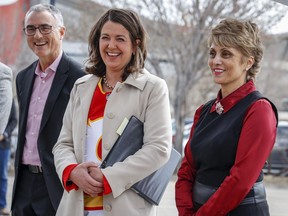 Calgary Mayor Jyoti Gondek, right, Alberta Premier Danielle Smith, centre, and Calgary Sport and Entertainment Corp. CEO John Bean attend an announcement on plans for an events centre to replace the aging Saddledome, in Calgary, Alta., Tuesday, April 25, 2023.THE CANADIAN PRESS/Jeff McIntosh