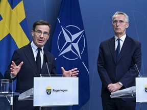 FILE - Sweden's Prime Minister Ulf Kristersson and NATO Secretary General Jens Stoltenberg during a press conference in Stockholm, Sweden, Tuesday, March 7, 2023. Russia is suspected of spying in the waters of the Baltic Sea and North Sea using civilian fishing trawlers, cargo ships and yachts, the public broadcasters of four Nordic countries said in a joint investigation published Wednesday, April 19. Swedish news agency TT quoted Prime Minister Ulf Kristersson as saying he wasn't surprised by the revelation of Russia's alleged "illegitimate information gathering."