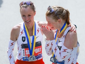 FILE -- Adrianne Haslet, right, cries as Shalane Flanagan, left, comforts her following their finish in the 2022 Boston Marathon, April 18, 2022, in Boston. Haslet is back in the field in 2023 for Monday's 127th Boston Marathon as the city, the country and fans of the cherished sporting event mark 10 years since the finish line attacks.