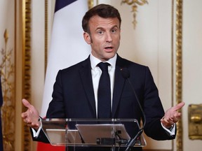 France's President Emmanuel Macron speaks to the media during a joint press conference with the Prime Minister of the Netherlands following a meeting in Amsterdam on April 12, 2023.