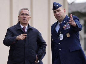 NATO Secretary General Jens Stoltenberg, left, arrives for a press statement prior to the meeting of the 'Ukraine Defense Contact Group' at Ramstein Air Base in Ramstein, Germany, Friday, April 21, 2023. The U.S. will begin training Ukrainian forces on how to use and maintain Abrams tanks in the coming weeks, as the U.S. continues to speed up its effort to get them onto the battlefield as quickly as possible, U.S. officials said Friday.