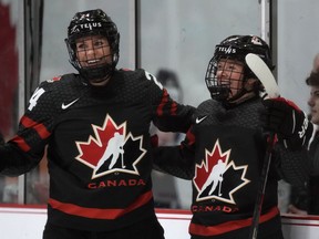 Canada forward Sarah Fillier, right, celebrates her goal with teammate Natalie Spooner during third period IIHF WomenÕs World Hockey Championship hockey action in Brampton, Ont., on Wednesday, April 5, 2023.