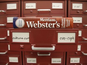 A Merriam-Webster dictionary sits atop their citation files at the dictionary publisher's offices on Dec. 9, 2014, in Springfield, Mass.