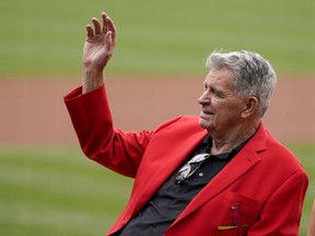 FILE - Mike Shannon waves as he is honored before the start of a baseball game between the St. Louis Cardinals and the Chicago Cubs, Oct. 3, 2021, in St. Louis. Shannon, a two-time World Series winner and longtime St. Louis Cardinals broadcaster, has died. He was 83.