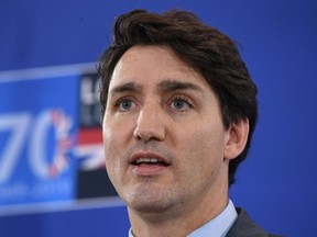Canadian Prime Minister Justin Trudeau gives a press conference in the media centre at the NATO summit held in the Grove hotel in on December 4, 2019 in Hertford, England.