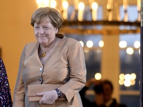Former German Chancellor Angela Merkel arrives at the Bellevue Palace to attend the State Banquet in Berlin, Wednesday, March 29, 2023. King Charles III arrived Wednesday for a three-day official visit to Germany.