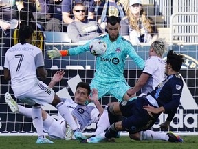 Philadelphia Union's Julian Carranza, right, tries to get a shot past Toronto FC keeper Quentin Westberg, centre, during the first half of an MLS soccer match, Sunday, Oct. 9, 2022, in Chester, Pa. Toronto FC will get another look at Westberg on Saturday, this time in Atlanta United colours.