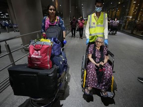 Indian citizens who were evacuated from Sudan arrive at the Mumbai International Airport in Mumbai, India, Thursday, April 27, 2023. India has moved nearly 2,000 of its 3,500 nationals out of the conflict zone in Sudan and they are on their way home via Jeddah, a top Indian official said on Thursday.