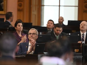 This image provided by the Ohio House Republican Caucus shows Rep. Dave Dobos, a Columbus-area Republican, sitting in the House chamber at the Ohio Statehouse in Columbus, Ohio on March 1, 2023. Dobos is under fire for falsely claiming for decades that he graduated from the Massachusetts Institute of Technology and has since stepped down from a House committee leadership post following the revelation. (Ohio House Republican Caucus via AP)