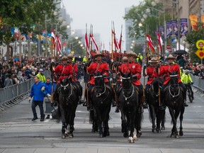 Members of the Royal Canadian Mounted Police (RCMP) are seen during a parade in honour of the late Queen Elizabeth as it makes its way down Wellington St., in Ottawa, Monday, Sept. 19, 2022. The RCMP is hoping to boost recruitment numbers in marking its upcoming 150th anniversary -- even as the national force's structure and practices come under damning new scrutiny.