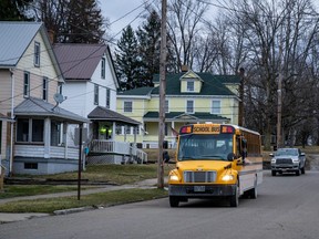 FILE: A school bus drives down E Main Street on February 24, 2023 in East Palestine, Ohio.