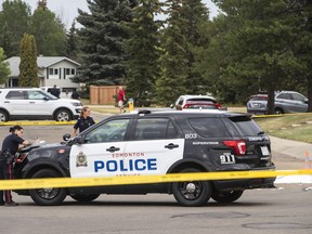 Police in Edmonton say 2022 saw the highest number of violent criminal events ever reported in a single year. Police investigate the scene of a stabbing where one person was killed and two others injured in Edmonton, on Wednesday Sept. 7, 2022.