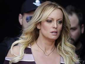 Adult film actress Stormy Daniels arrives for the opening of the adult entertainment fair Venus in Berlin, Oct. 11, 2018.