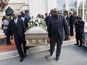 The casket of Irvo Otieno is carried out of First Baptist Church of South Richmond after the celebration of life for Irvo Otieno in North Chesterfield, Va., on Wednesday, March 29, 2023. Irvo Otieno, a 28-year-old Black man, died after he was pinned to the floor by seven sheriff's deputies and several others while he was being admitted to a mental hospital.