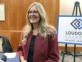 FILE - Rep. Jennifer Wexton, D-Va, speaks with reporters on Oct. 20, 2022, in Leesburg, Va. Wexton announced Tuesday, April 11, 2023, she has been diagnosed with Parkinson's disease. She is vowing to continue her work in Congress and says "I'm not going to let Parkinson's stop me from being me."