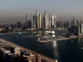 FILE - Luxury towers dominate the skyline in the Marina district, center, and the new Dubai Harbour development, right, are seen from the observation deck of "The View at The Palm Jumeirah" in Dubai, United Arab Emirates, April 6, 2021. The head of Russia's Foreign Intelligence Service, Sergey Naryshkin, held extensive meetings with United Arab Emirates leaders in Dubai in 2020. A U.S. official separately has told the AP that the United States also was worried about Russian money coming into Dubai's red-hot real estate market.