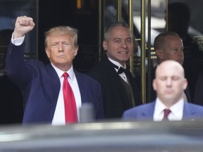 FILE - Former President Donald Trump leaves Trump Tower in New York on Tuesday, April 4, 2023. Only 4 in 10 U.S. adults believe Trump acted illegally in New York, where he has been charged in connection with hush money payments made to women who alleged sexual encounters, according to a new poll by The Associated Press-NORC Center for Public Affairs Research. More -- about half -- believe he broke the law in Georgia, where he is under investigation for interfering in the 2020 election vote count.