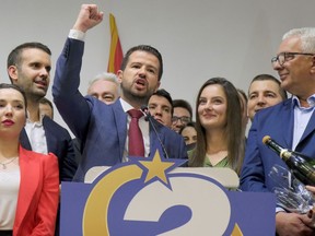 Jakov Milatovic, center left, leader of the Europe Now movement celebrates in his headquarters in Montenegro's capital Podgorica, Sunday, April 2, 2023. Milatovic, an economy expert and political novice, won the presidential runoff election on Sunday, defeating the pro-Western incumbent who has been in power for more than three decades in the small NATO member nation in Europe, the candidates and polls said.