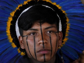 An Indigenous man attends the closing of the annual Terra Livre, or Free Land Indigenous Encampment in Brasilia, Brazil, Friday, April 28, 2023.