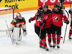 Canada's Lawson Crouse (67) celebrates his goal on Germany goalie Mathias Niederberger (35) during the gold medal match at the Ice Hockey World Championship in Tampere, Finland, Sunday, May 28, 2023.