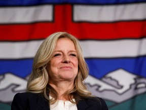 Rachel Notely in front of Alberta flag