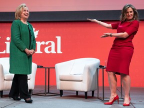 Former U.S. Secretary of State Hillary Clinton, left, is introduced to the stage by Finance Chrystia Freeland take part in a keynote address during the second day of the Liberal Convention in Ottawa, on Friday, May 5, 2023. THE CANADIAN PRESS/Spencer Colby