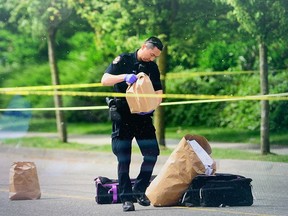 Vancouver Police at the scene of a shooting in the area of Fraser Street and Southeast Marine Drive on Sunday, May 28, 2023.