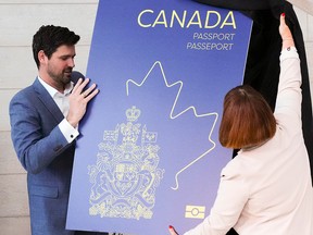 Immigration and Citizenship Minister Sean Fraser and Marie-France Lalonde, Parliamentary Secretary, unveil the new Canadian passport on May 10, 2023.