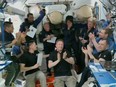 An image from a NASA video shows 11 astronauts aboard the International Space Station.