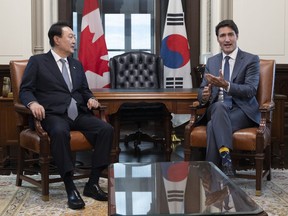 Canadian Prime Minister Justin Trudeau and South Korean President Yoon Suk Yeol speak at the start of a meeting in his office on Parliament Hill, in Ottawa, Friday, Sept. 23, 2022.