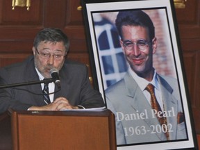 FILE - Dr. Judea Pearl, left, father of American journalist Daniel Pearl, right, who was killed by terrorists in 2002, speaks in Miami Beach, Fla., April 15, 2007. Geivens Dextra, a violinist who is scheduled to graduate from Pittsfield High School next week, is this year's recipient of a college scholarship given in honor of former Wall Street Journal reporter Daniel Pearl, who was kidnapped and killed in Pakistan in January 2002 while investigating a story on terrorism.