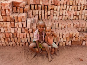 Child workers at a brickyard in Dhaka, Bangladesh on March 16, 2022. (Kazi Salahuddin Razu/NurPhoto)