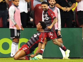 Toronto FC midfielder Kosi Thompson (47) celebrates his goal against D.C. United with teammate Lorenzo Insigne (24) during second half MLS action in Toronto on Saturday, May 27, 2023.THE CANADIAN PRESS/Chris Young