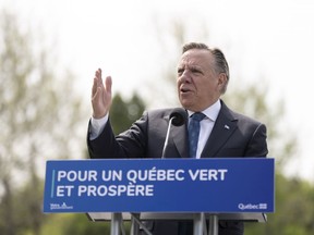 Quebec Premier François Legault discusses Quebec's greenhouse gas reduction plan during a news conference on Friday May 19, 2023, in Montreal.