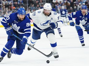 Toronto Maple Leafs forward Ryan O'Reilly (90) protects the puck from Tampa Bay Lightning defenceman Victor Hedman (77) during second period NHL Stanley Cup playoff hockey action in Toronto on Thursday, April 27, 2023. O'Reilly is one of the names poised to hit the free agency market.