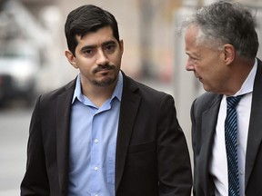 FILE - Former state Rep. Michael DiMassa, left, arrives at U.S. District Court in Hartford, Conn., with his attorney John Gulash, Nov. 1, 2022. DiMassa is scheduled to be sentenced Wednesday, May 31, 2023, for stealing more than $1.2 million from the city of West Haven, Conn., most of it in federal coronavirus-related aid, and using a good chunk of it to fuel his gambling addiction.
