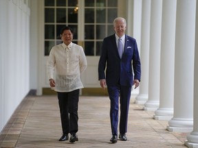 President Joe Biden and Philippines President Ferdinand Marcos Jr. walk on the West Colonnade to the Oval Office following a welcome ceremony at the White House in Washington, Monday, May 1, 2023.