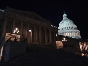Lights illuminate the capitol after House Speaker Kevin McCarthy of Calif., announced that he and President Joe Biden and McCarthy had reached an 