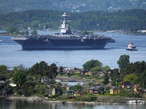 The American aircraft carrier USS Gerald R. Ford drives in the Oslo Fjord, Norway, here seen from Ekebergskrenten, Wednesday, May 24, 2023. The ship is the world's largest warship and will be in port in Oslo for four days.