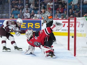 Peterborough Petes' J.R. Avon (10) scores against Quebec Remparts goalie William Rousseau (35) during second period Memorial Cup hockey action, in Kamloops, B.C., on Tuesday, May 30, 2023.