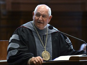 FILE - Sonny Perdue, the 14th chancellor of the University System of Georgia, speaks during his investiture at the state Capitol in Atlanta, Sept. 9, 2022. The system's board of regents voted on Tuesday, May 16, 2023, to mostly keep tuition level for the 2023-24 academic year, a move that Perdue said would leave the system looking to state lawmakers to restore a funding cut next year.