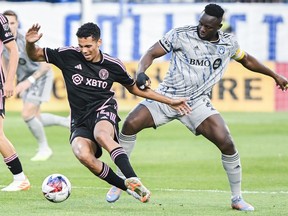 CF Montreal's Victor Wanyama, right, challenges Inter Miami's Jean Corentin during first half MLS soccer action in Montreal, Saturday, May 27, 2023.
