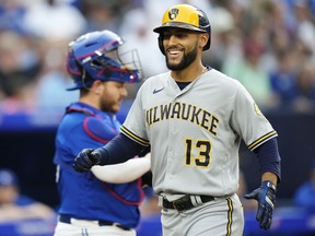 Milwaukee Brewers' Abraham Toro (13) celebrates his two-run home run against the Toronto Blue Jays during second inning MLB baseball action in Toronto on Wednesday, May 31, 2023.THE CANADIAN PRESS/Frank Gunn