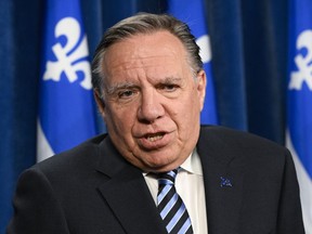 Quebec Premier François Legault responds to reporters' questions at a news conference, Tuesday, May 23, 2023, at the legislature in Quebec City.