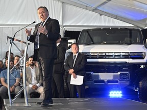 Quebec Premier François Legault speaks to guests as his government and the federal government announce major investments in EV car battery-making components, Monday, May 29, 2023, in Becancour, Que.