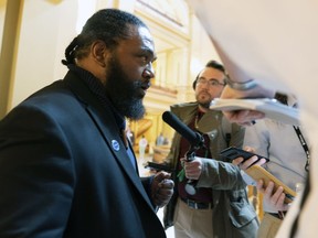 FILE - Kansas state Rep. Marvin Robinson, D-Kansas City, explains why he switched his vote on a transgender athletes bill override following a vote in the House, April 5, 2023, in Topeka, Kan. On Monday, May 15, Gov. Laura Kelly vetoed money in the next state budget for a project in the Kansas City, Kan., district of a dissident Democratic lawmaker whose votes to override her vetoes were crucial to enacting new laws rolling back transgender rights and restricting abortion providers.